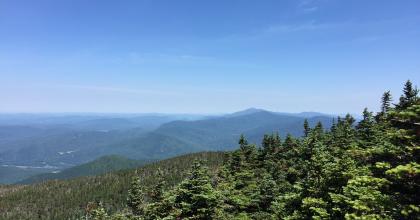 A photograph of Camel's Hump State Park from above the treeline