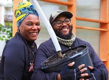 Two people happy to have a new tree