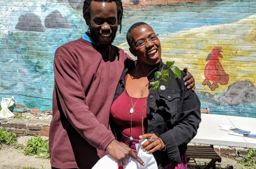 Two happy people with a tree